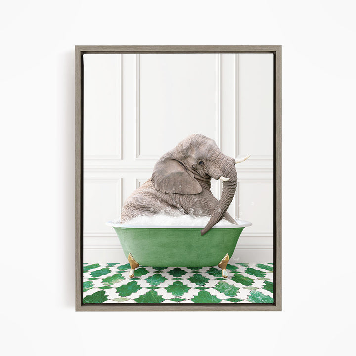 A gray elephant is sitting in a green bathtub filled with water, surrounded by a green and white patterned floor.