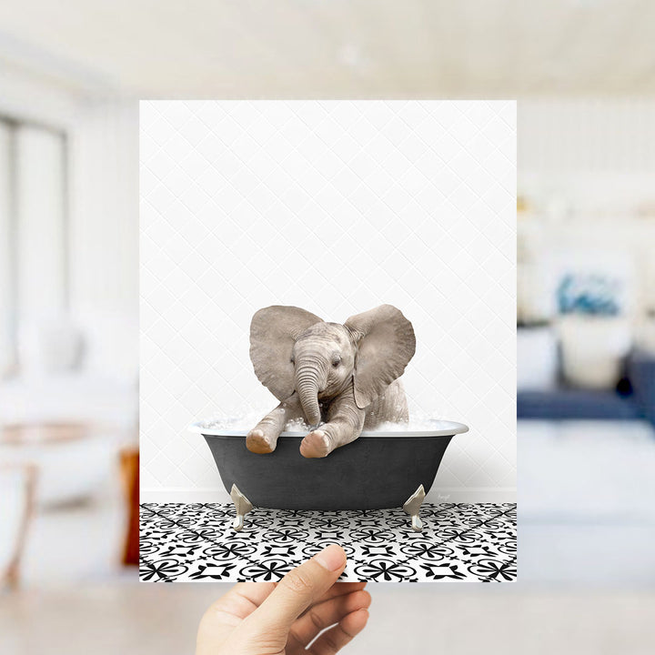 A small elephant sitting in a bathtub, surrounded by a patterned floor.