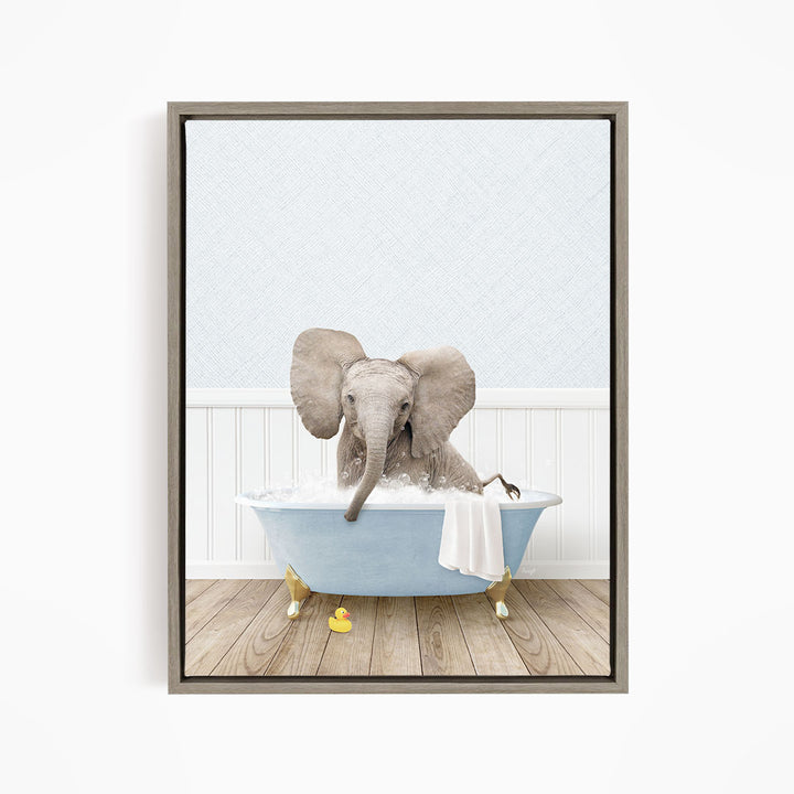 A baby elephant sitting in a blue bathtub filled with water, surrounded by rubber ducks.