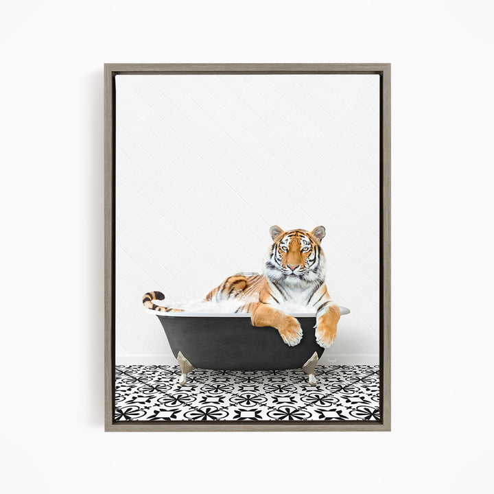 A tiger is sitting in a bathtub filled with water, surrounded by a black and white patterned floor.