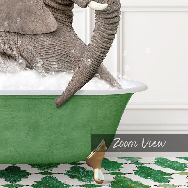 A large elephant is sitting in a green bathtub filled with bubbles, with its trunk submerged in the water.