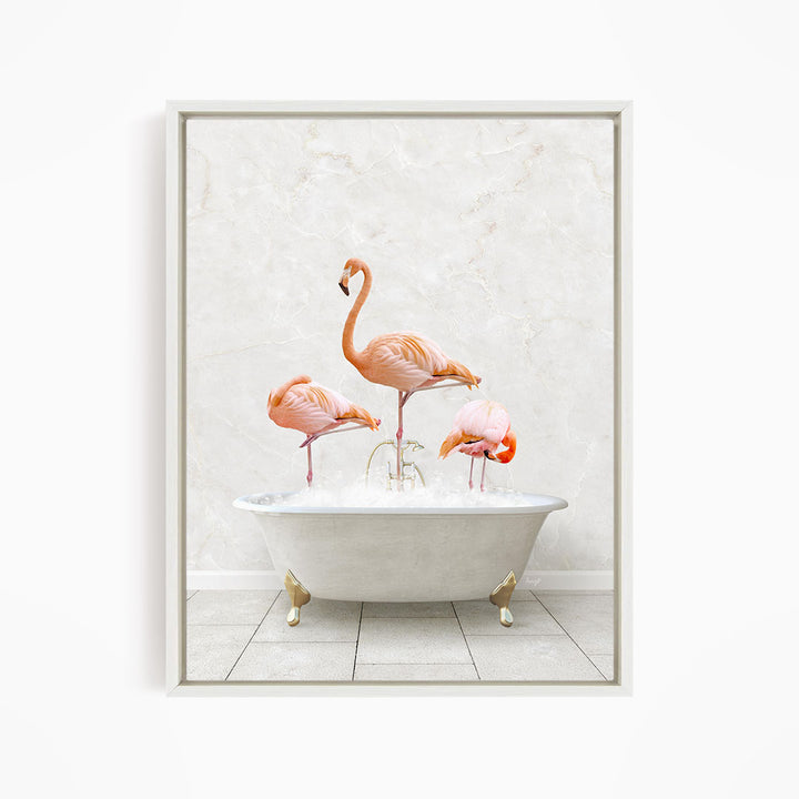 A framed image depicting three pink flamingos standing in a white bathtub filled with water.