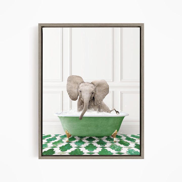 A baby elephant sitting in a green bathtub filled with water, surrounded by a green and white patterned floor.