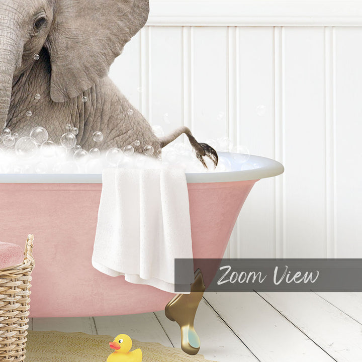 A large gray elephant is sitting in a pink bathtub filled with bubbles, surrounded by a yellow rubber duck and a white basket.