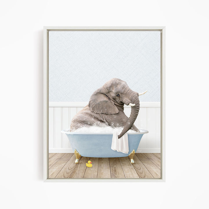 A gray elephant is sitting in a blue bathtub filled with water, surrounded by yellow rubber ducks.