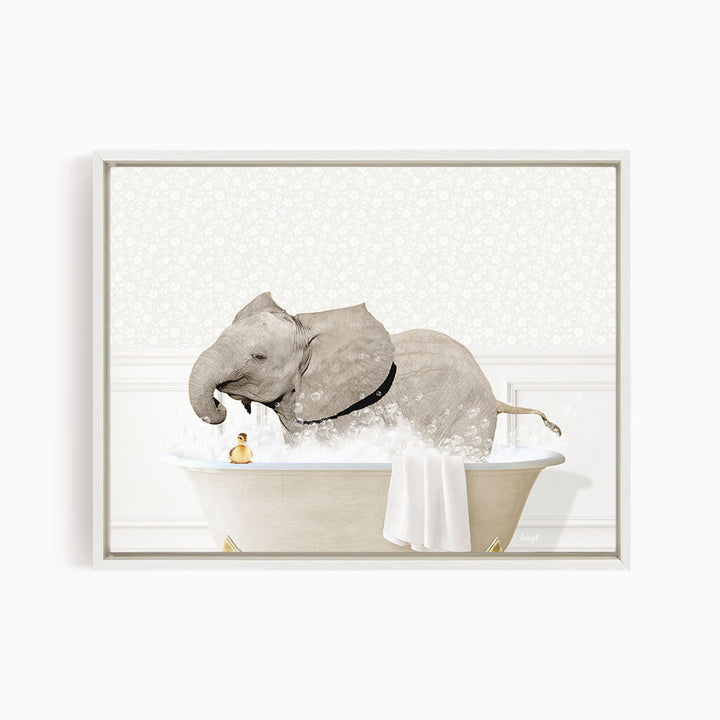A gray elephant is sitting in a bathtub filled with water, surrounded by a towel and a rubber duck.