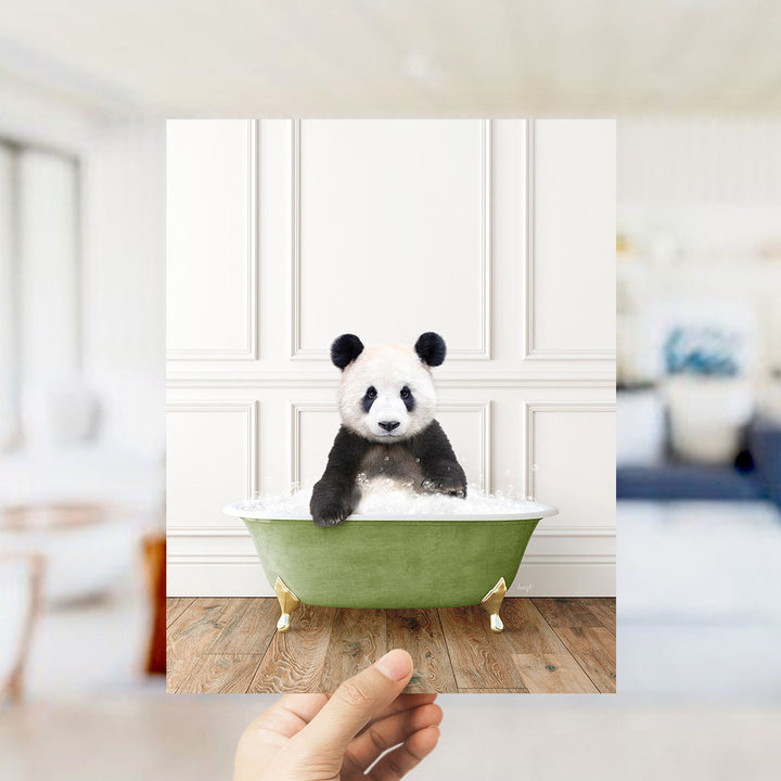 A panda bear sitting in a green bathtub filled with bubbles, surrounded by a blurred background.