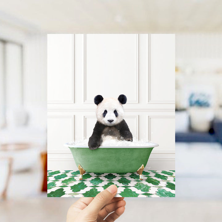 A panda bear sitting in a green bathtub filled with bubbles, surrounded by a green and white patterned floor.
