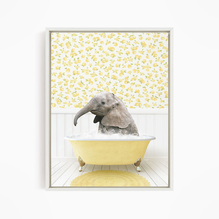 A baby elephant sitting in a yellow bathtub filled with water, surrounded by a yellow and white floral patterned wall.