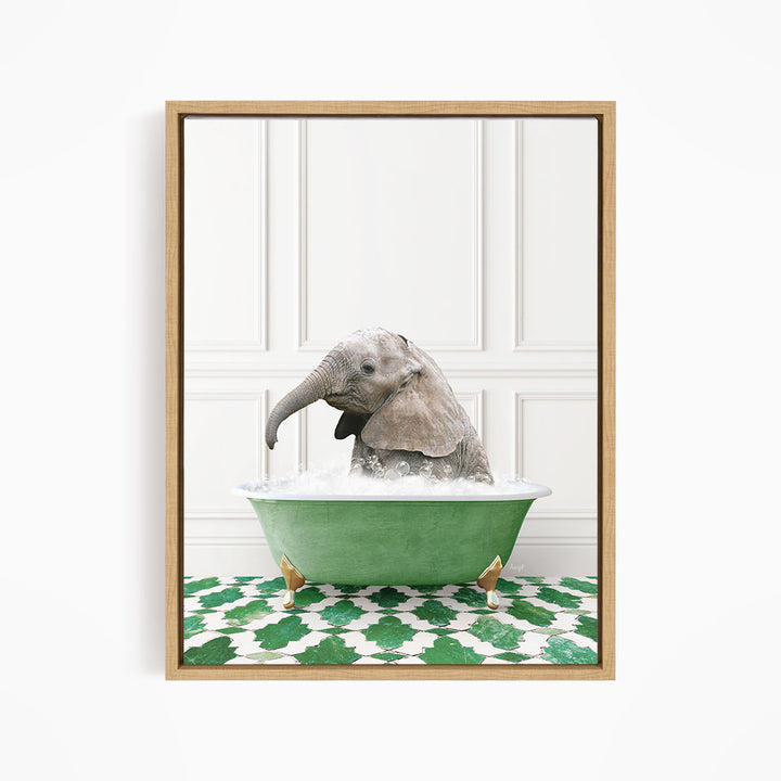 A baby elephant sitting in a green bathtub filled with water, surrounded by a green and white patterned floor.