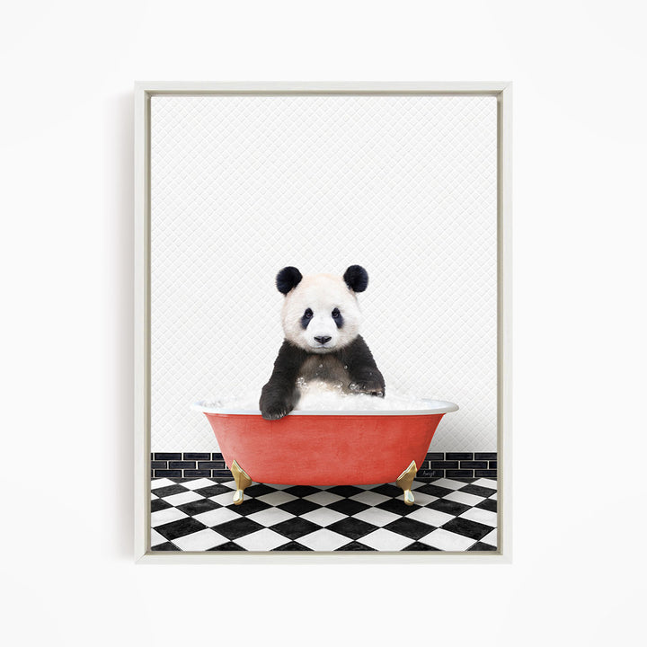 A panda bear sitting in a red bathtub on a black and white checkered floor.