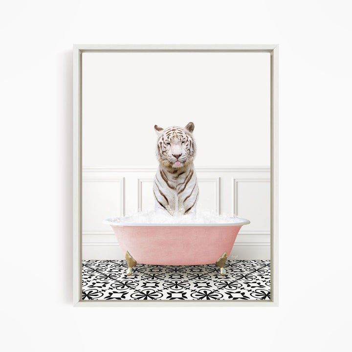 A white tiger sitting in a pink bathtub filled with bubbles, surrounded by a black and white patterned floor.
