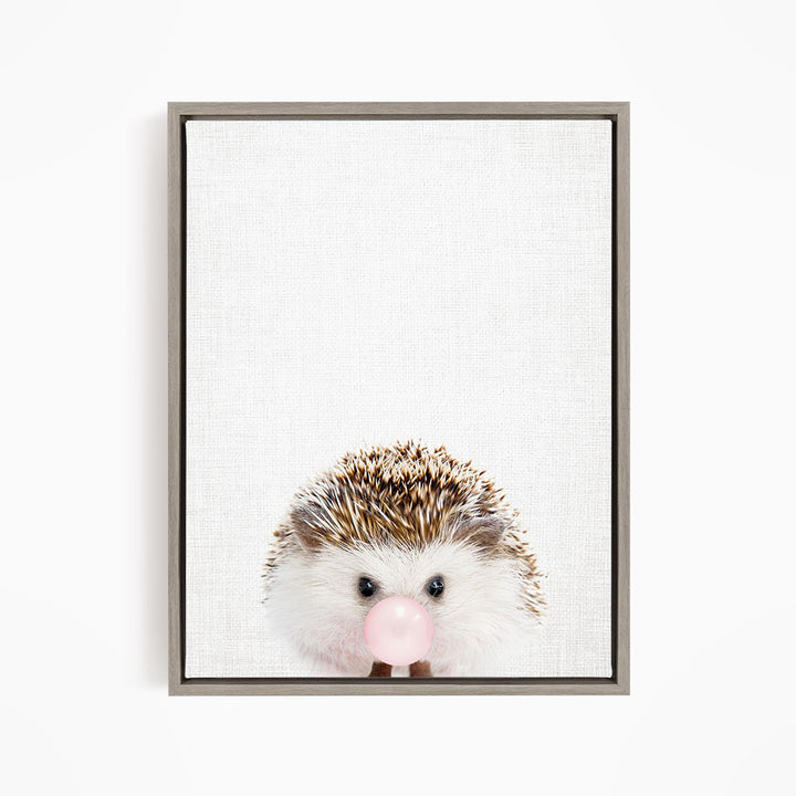 A cute hedgehog with a pink bubble in its mouth is the main subject of the image.