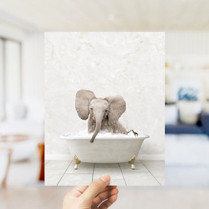 A small elephant sitting in a white bathtub filled with water, with its trunk submerged in the water.