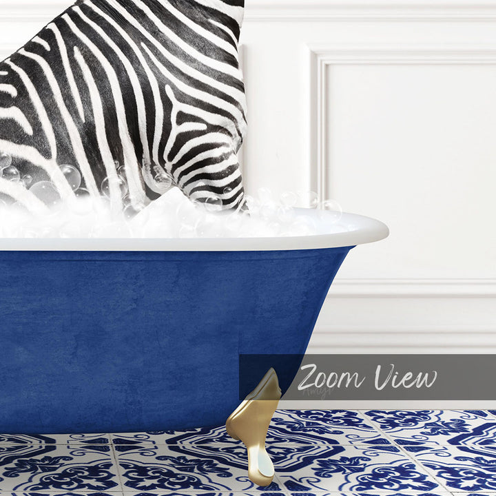 A zebra standing in a blue bathtub filled with bubbles, with a gold bathtub faucet visible.