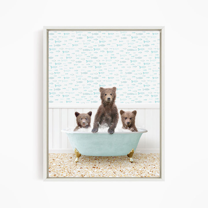 Three brown bears sitting in a light blue bathtub, with a patterned wall behind them.