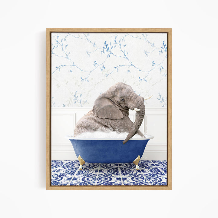 A gray elephant is sitting in a blue bathtub, surrounded by a blue and white patterned rug on the floor.