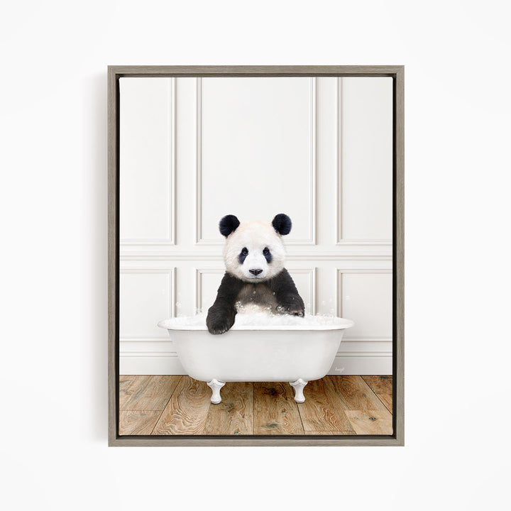 A panda bear sitting in a white bathtub, enjoying a relaxing bath.