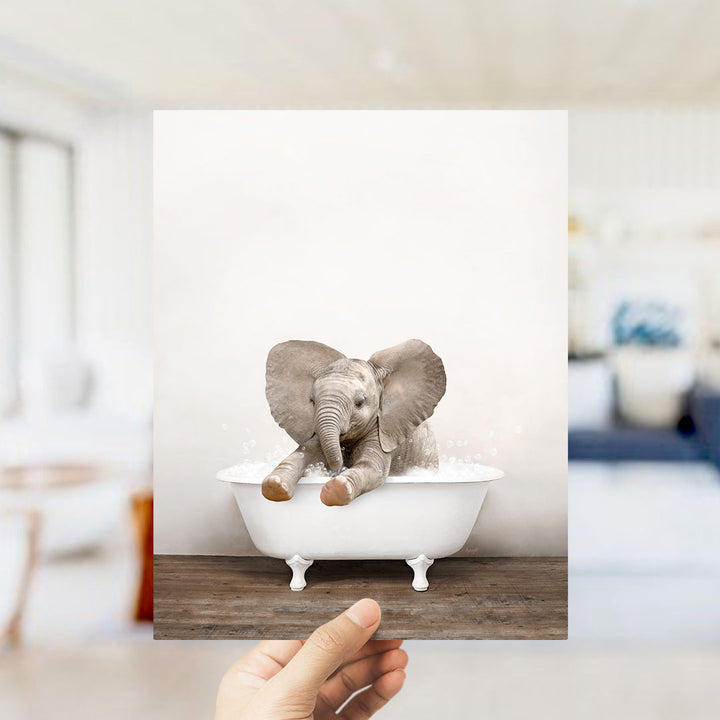 A small elephant sitting in a white bathtub, with its trunk in the water, creating a whimsical and playful scene.