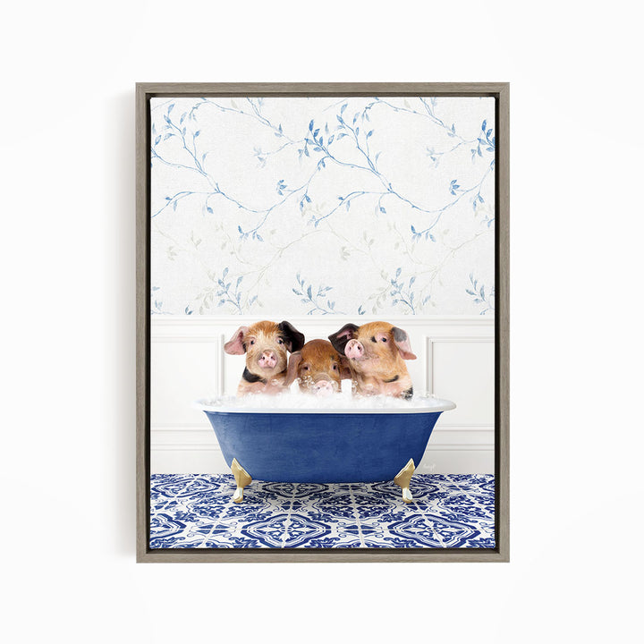 Three adorable pigs sitting in a blue bathtub, with a floral patterned wall behind them.