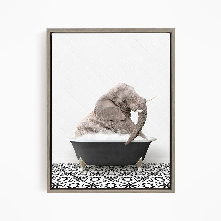 A gray elephant is sitting in a black bathtub filled with water, surrounded by a black and white patterned floor.