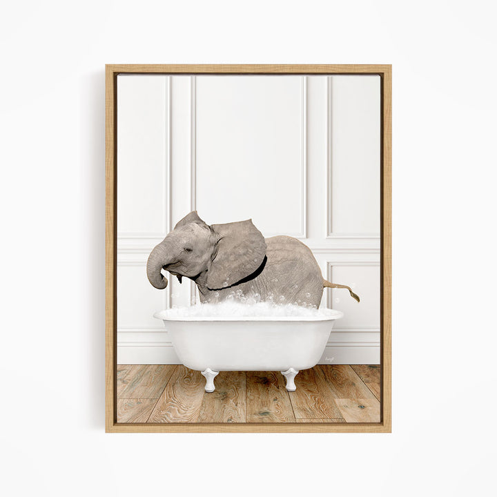 A gray elephant is sitting in a white bathtub filled with water, creating a whimsical and playful scene.