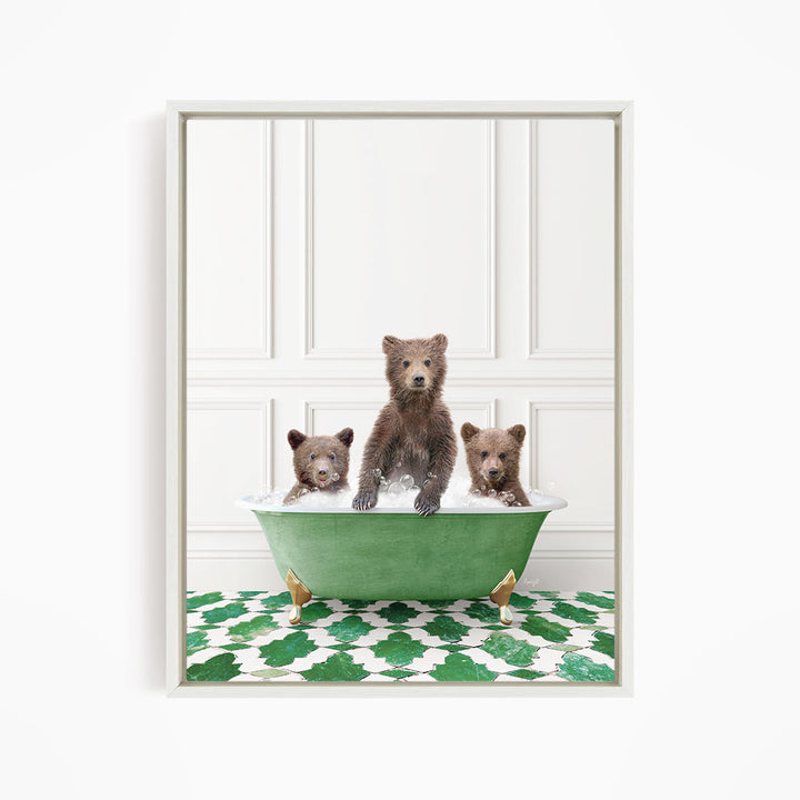 A framed image depicting three bears sitting in a green bathtub filled with water, with a patterned green and white floor beneath them.