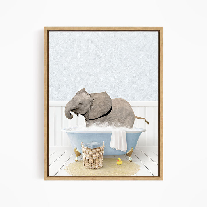 A gray elephant is sitting in a blue bathtub filled with water, surrounded by yellow rubber ducks.