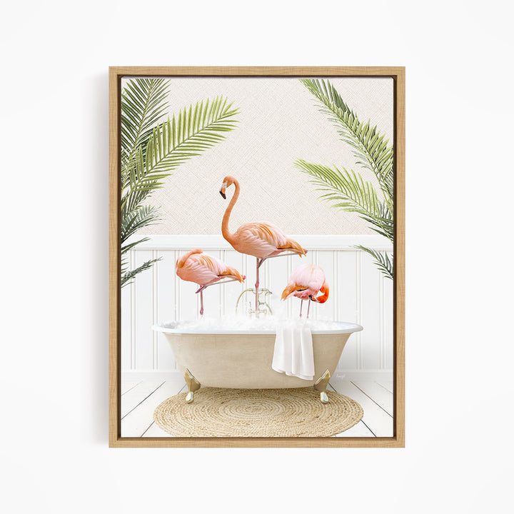 A framed image depicting three pink flamingos standing in a white bathtub, surrounded by green palm leaves.