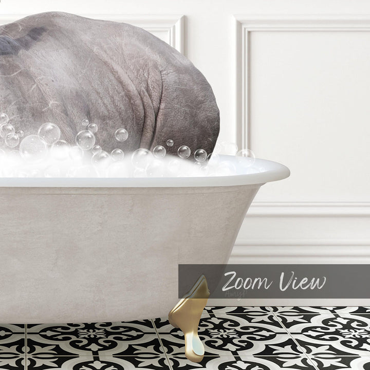 A large gray elephant is sitting in a white bathtub filled with bubbles, with a black and white patterned floor in the foreground.