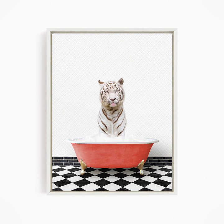 A white tiger sitting in a red bathtub filled with bubbles, with a black and white checkered floor in the background.