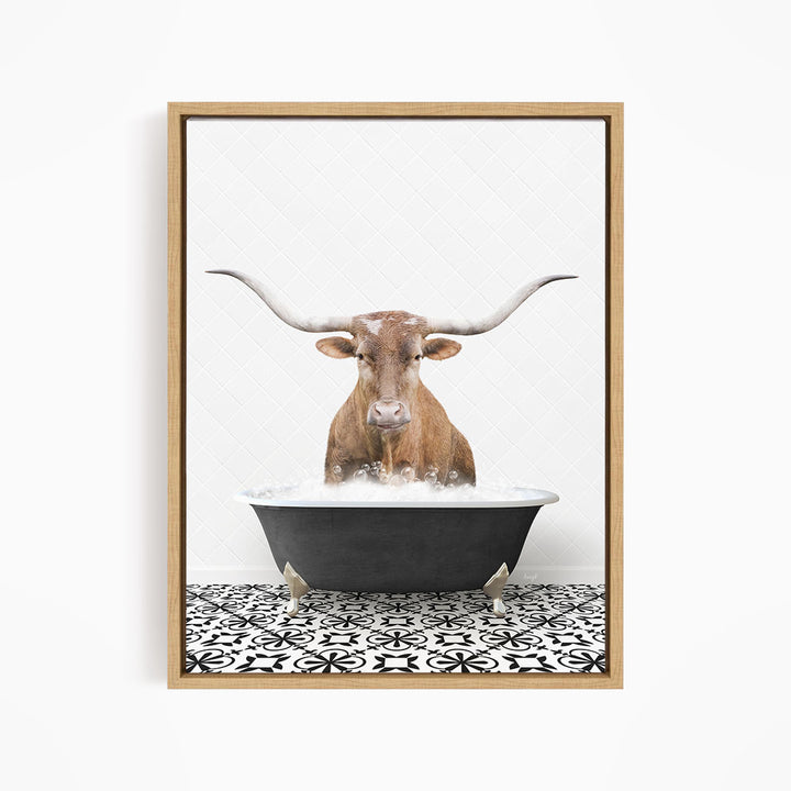 A brown steer with long horns is sitting in a black tub filled with water, creating a whimsical and humorous scene.