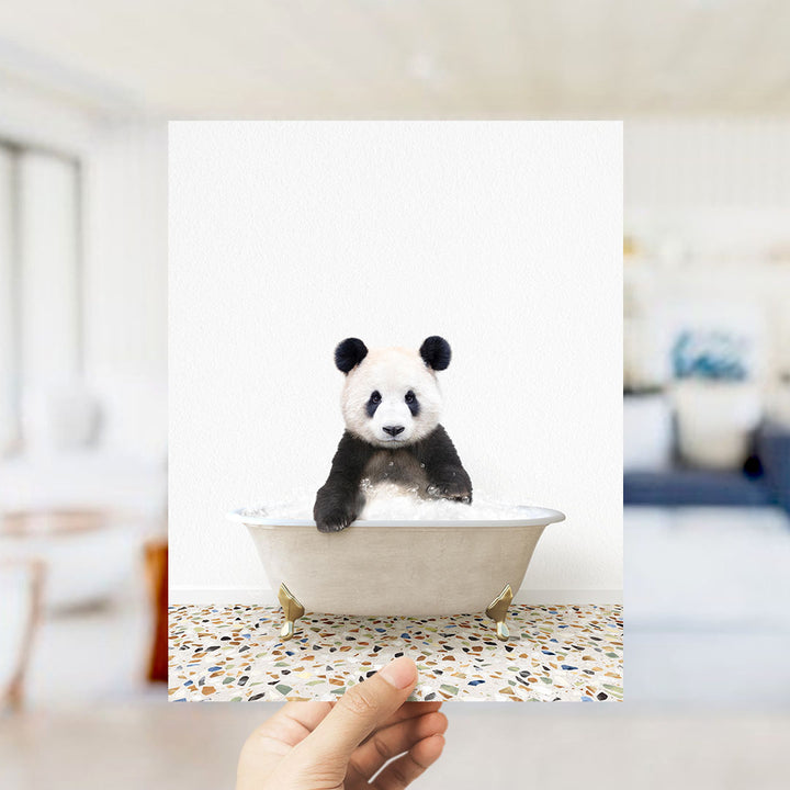A panda bear sitting in a bathtub filled with water, surrounded by a tiled floor.