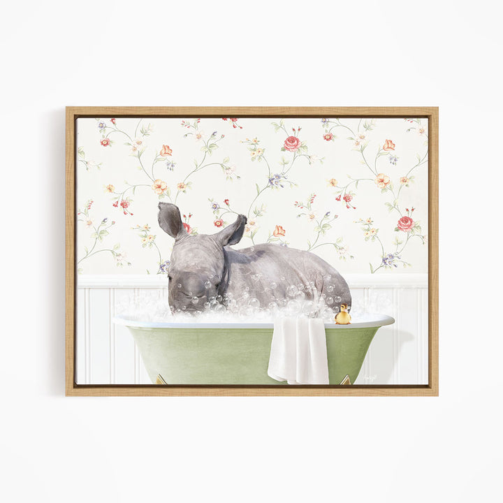 A rhinoceros is sitting in a green bathtub filled with water, surrounded by a floral wallpaper.