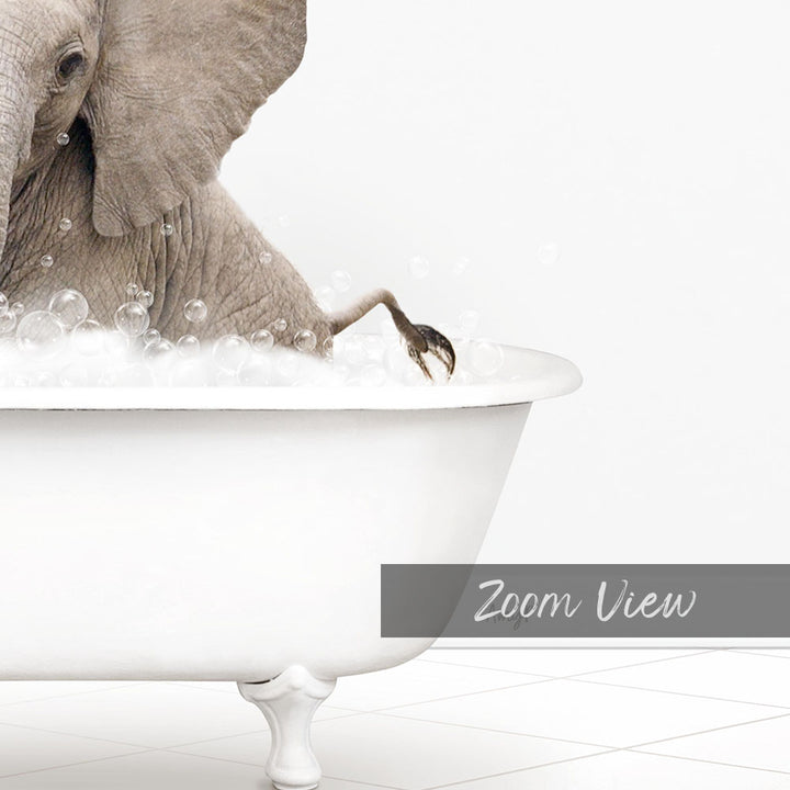 A large elephant is sitting in a white bathtub filled with bubbles, creating a whimsical and playful scene.