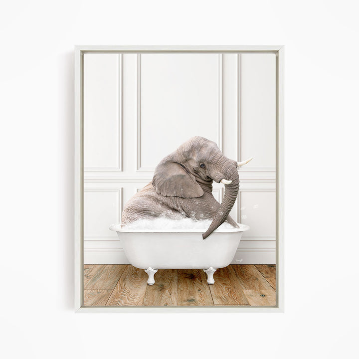 A gray elephant is sitting in a white bathtub filled with water, creating a whimsical and playful scene.