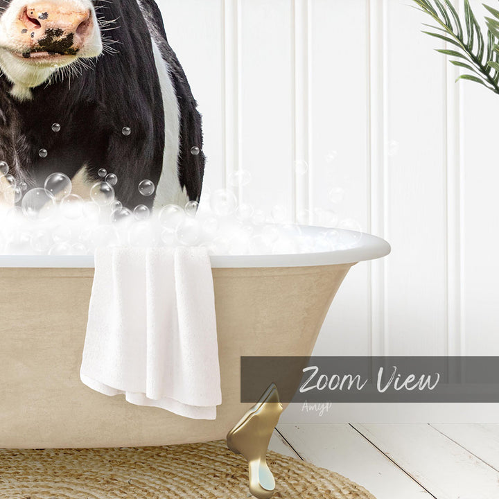 A cow is sitting in a bathtub filled with bubbles, with a towel and a plant nearby.