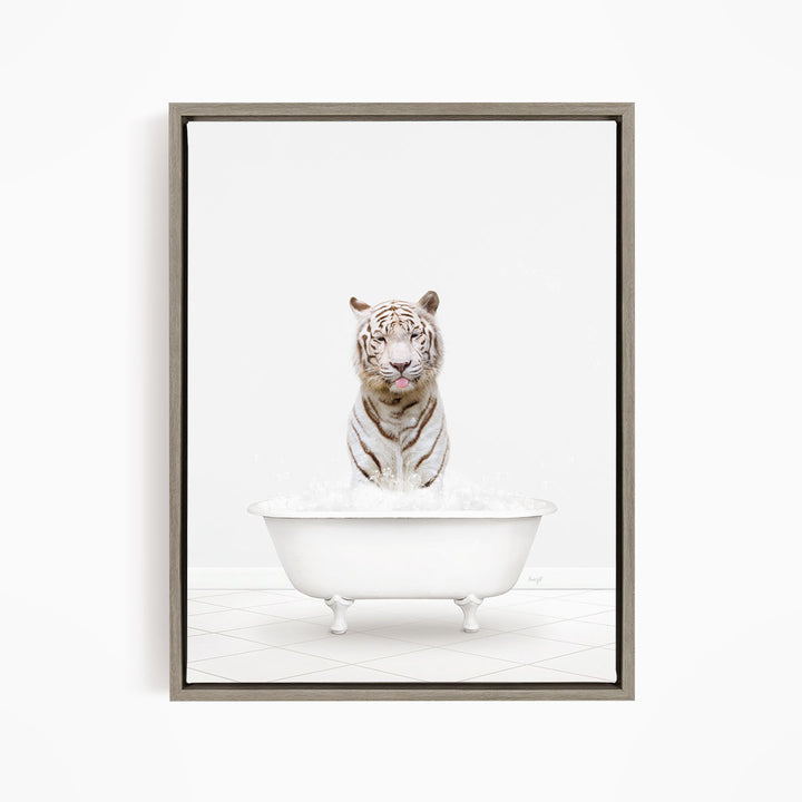 A white tiger sitting in a white bathtub filled with water.