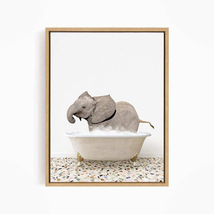 A gray elephant is sitting in a white bathtub filled with water, creating a whimsical and playful scene.