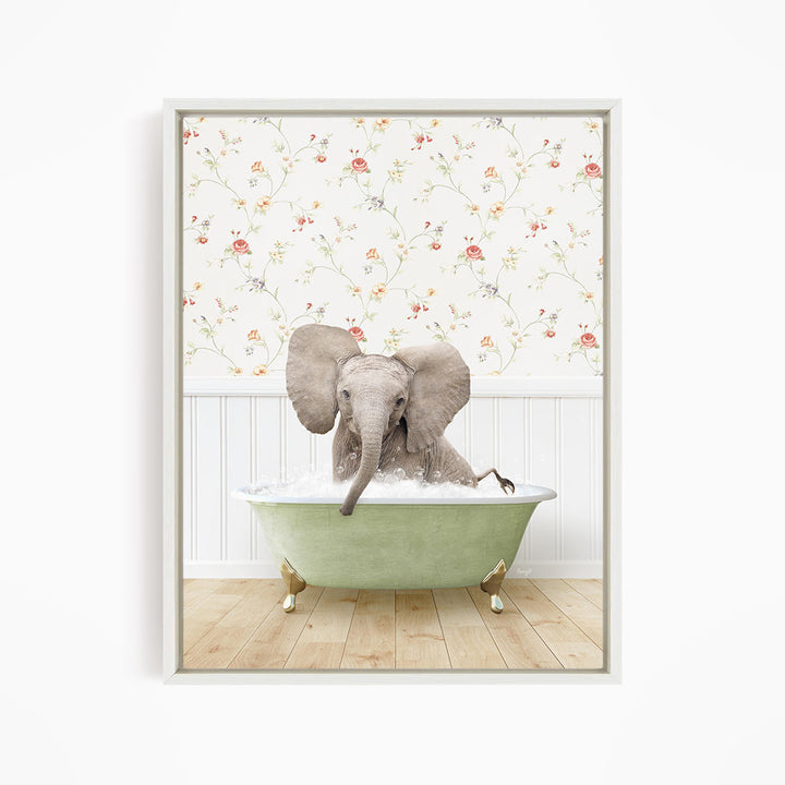 A gray elephant sitting in a green bathtub filled with water, surrounded by a floral wallpaper.