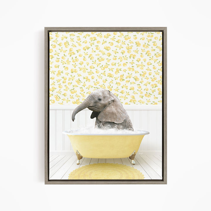 A baby elephant sitting in a yellow bathtub filled with water, surrounded by a yellow and white floral patterned wall.