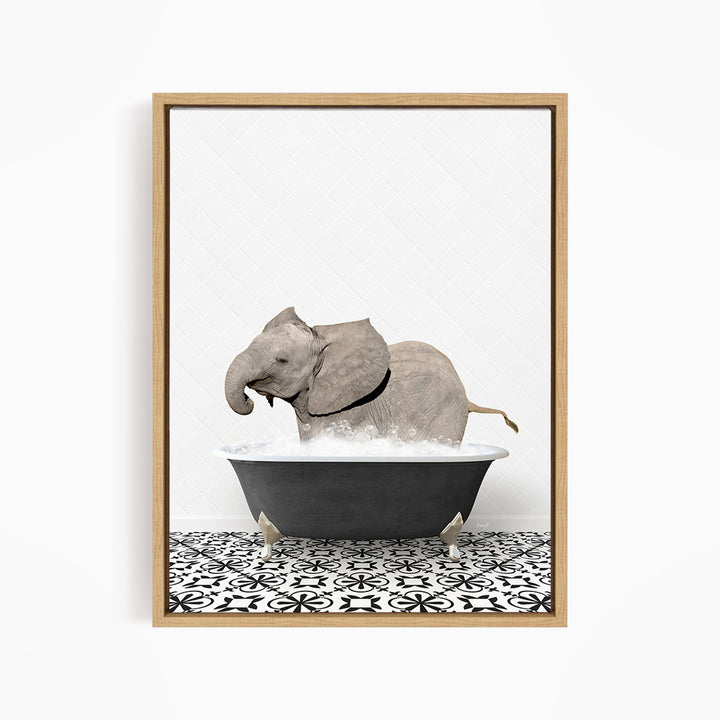 A gray elephant is sitting in a black bathtub filled with water, creating a whimsical and playful scene.