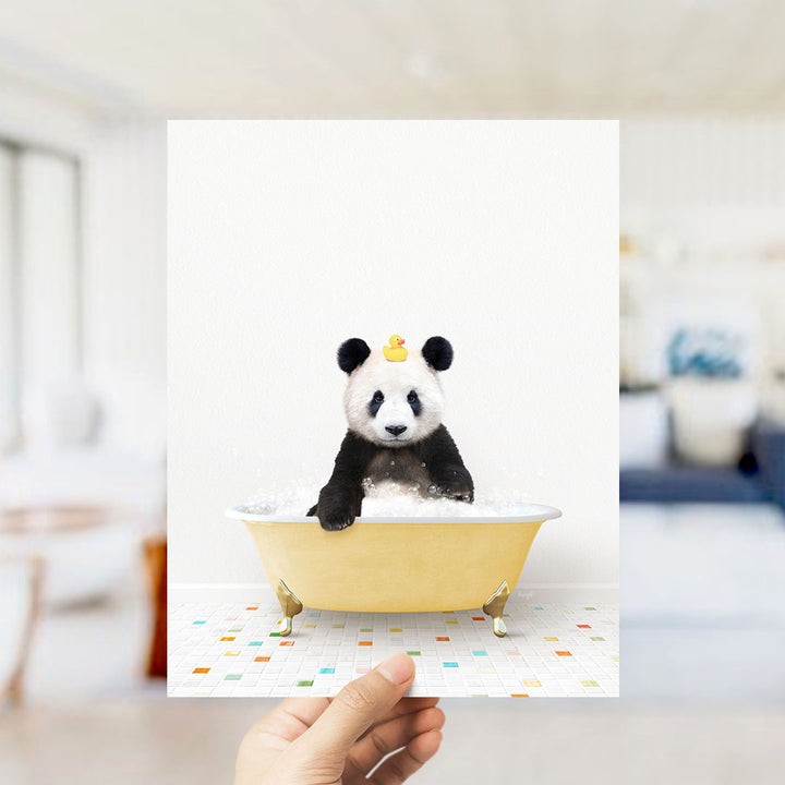 A panda bear sitting in a yellow bathtub with a rubber duck on its head.
