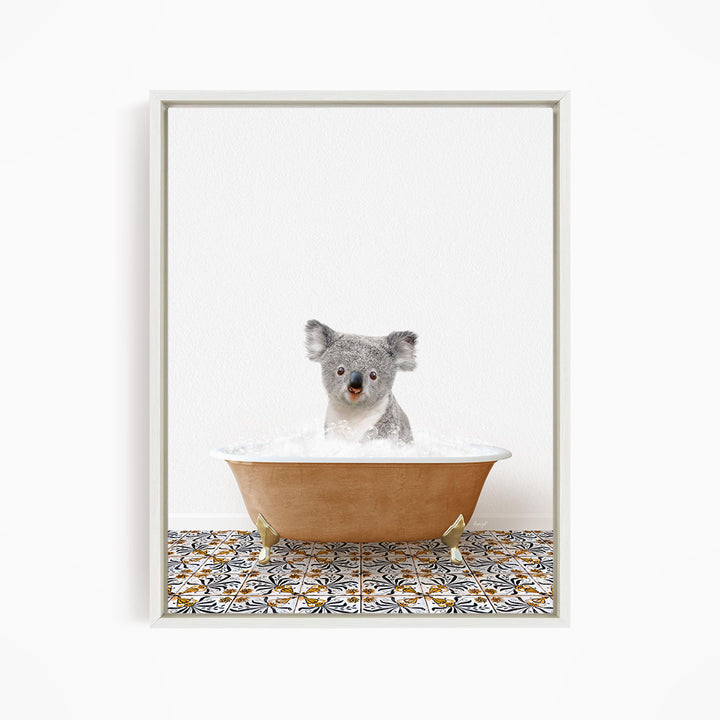 A koala bear sitting in a bathtub filled with water, surrounded by a patterned tile floor.