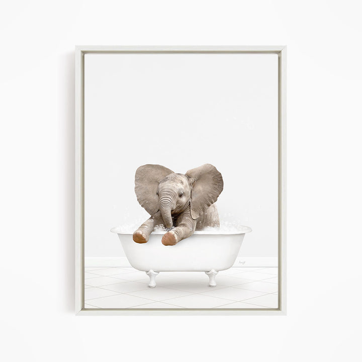 A baby elephant sitting in a white bathtub, enjoying a bath.