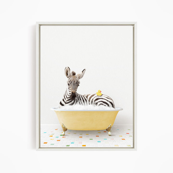A zebra is sitting in a yellow bathtub, with a rubber duck resting on its back.