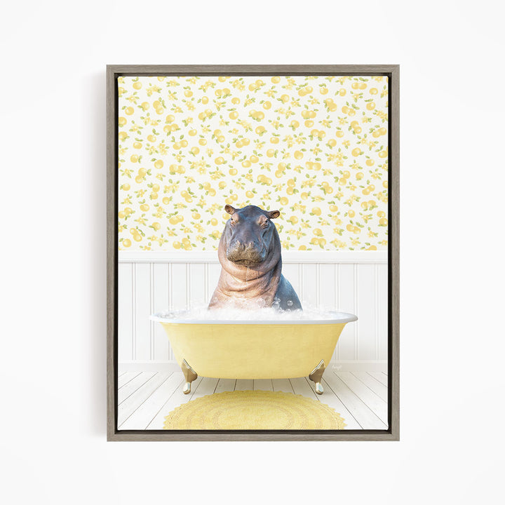 A hippopotamus sitting in a yellow bathtub filled with water, surrounded by a yellow floral pattern on the wall behind it.