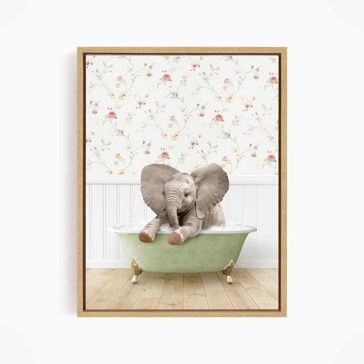 A baby elephant sitting in a green bathtub, surrounded by a floral wallpaper.
