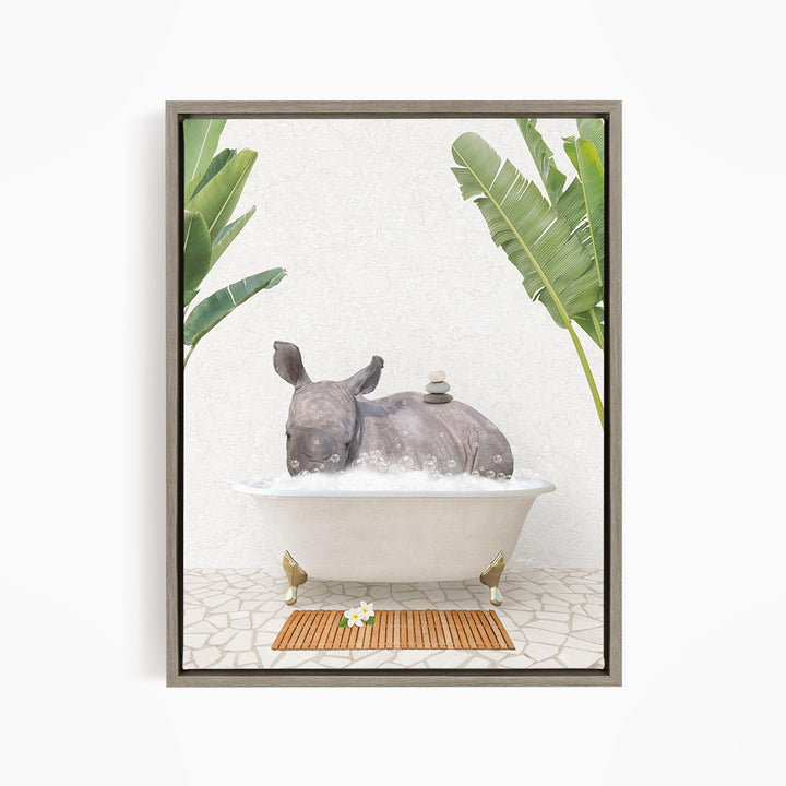 A rhinoceros is sitting in a bathtub filled with water, surrounded by tropical plants and a wooden mat on the floor.