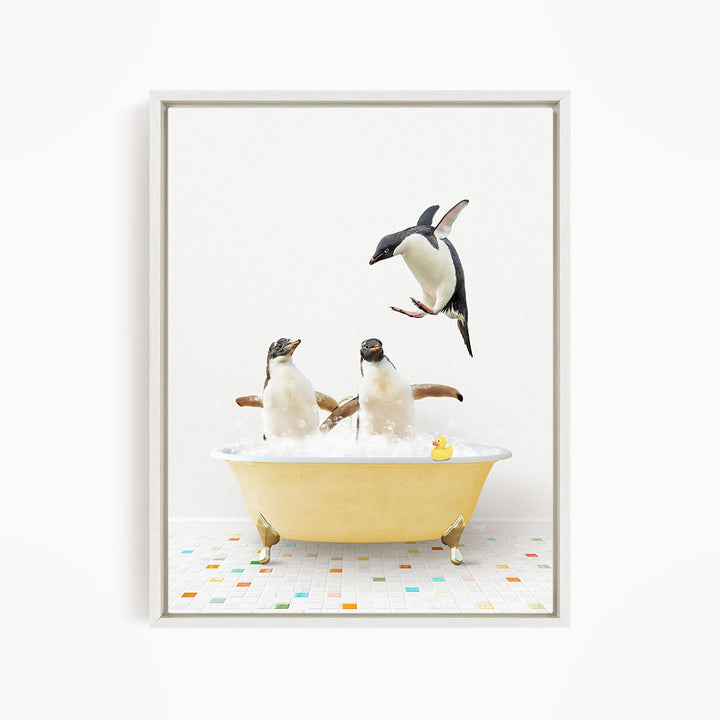 A framed image depicting two penguins sitting in a yellow bathtub, with one penguin flying towards the other penguin.